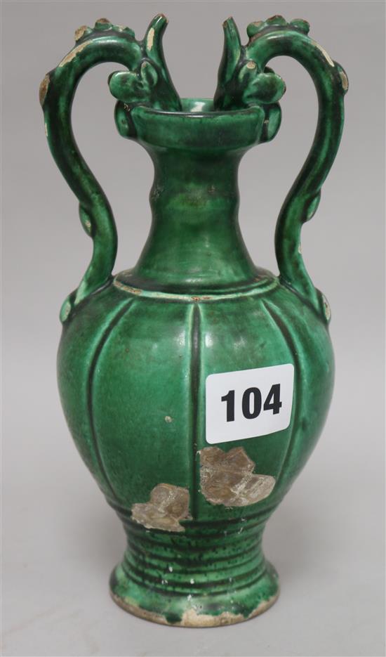 A Chinese green glazed pottery twin handled vase, in Tang style, 20.5cm.